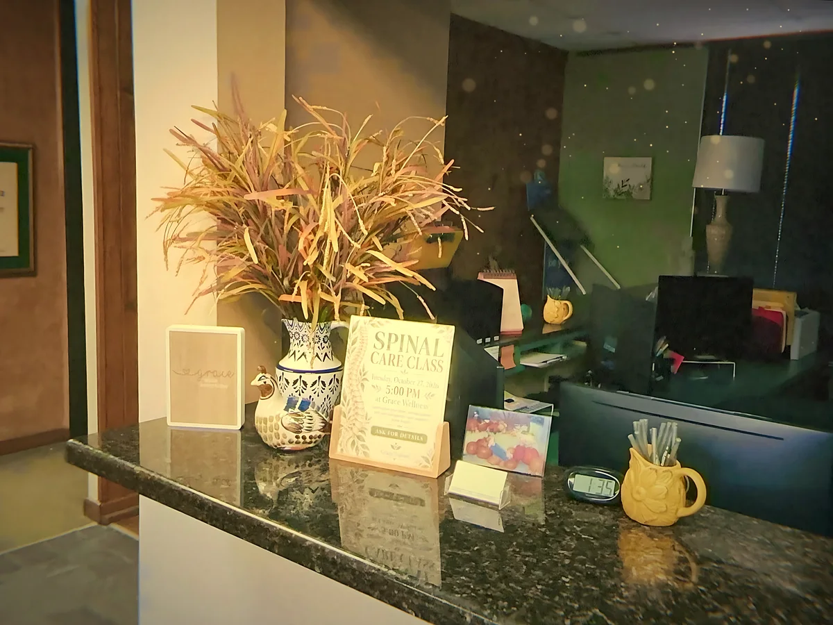 Dried wheat and a Spinal Care Class sign on the front desk