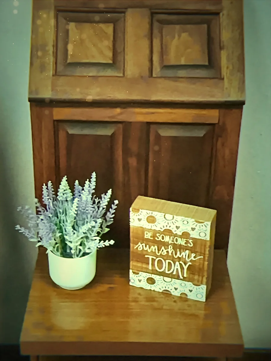 Lavender beside a Be Someone's Sunshine Today sign at Grace Wellness Center