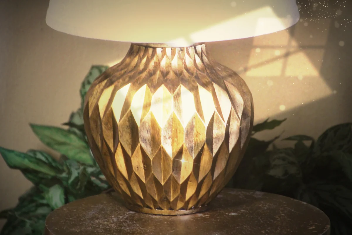 A gold lamp glowing in afternoon light